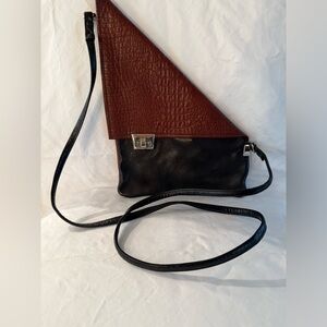 Leather crossbody by artist at juried art show.
